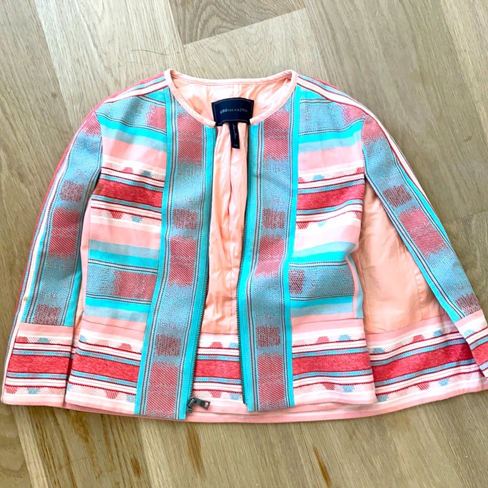 Beautiful cape jacket with arms opening , worn once.